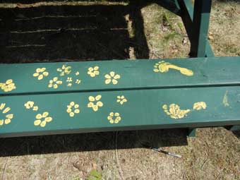 Picnic table with flowers, feet