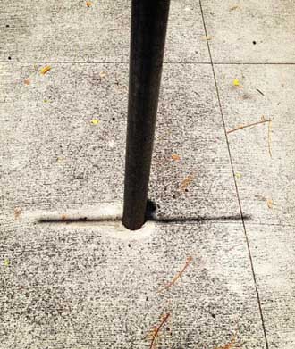 Thin sign on round pole